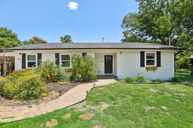 single story home featuring a front lawn