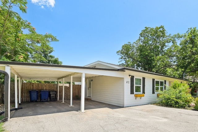 view of vehicle parking featuring a carport