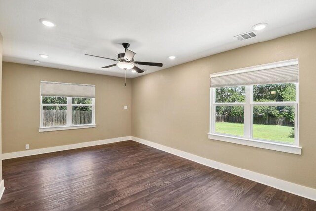 spare room with wood-type flooring and ceiling fan