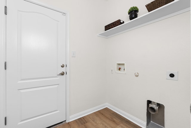 laundry area featuring hookup for a washing machine, gas dryer hookup, electric dryer hookup, and hardwood / wood-style floors