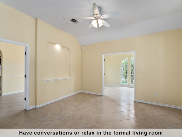 tiled spare room featuring ceiling fan