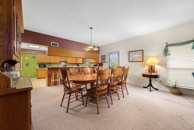 dining area with light colored carpet