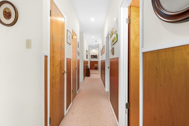 corridor with light colored carpet