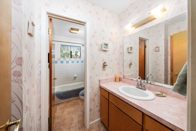 bathroom featuring a tub and vanity