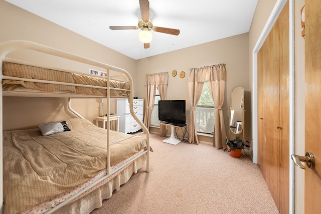 carpeted bedroom with ceiling fan