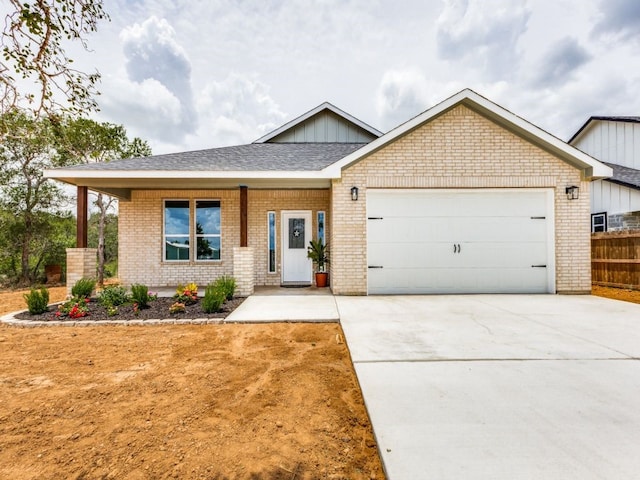 view of front of home featuring a garage and covered porch