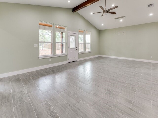 unfurnished room featuring ceiling fan and vaulted ceiling with beams