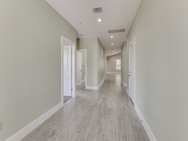 hall with light hardwood / wood-style floors