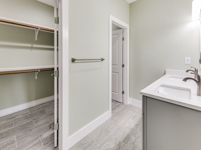 bathroom featuring tile patterned flooring and double sink vanity