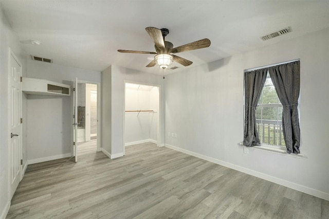 unfurnished bedroom featuring a closet, ceiling fan, and light hardwood / wood-style floors