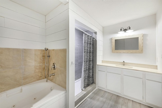 bathroom featuring vanity, independent shower and bath, and hardwood / wood-style flooring