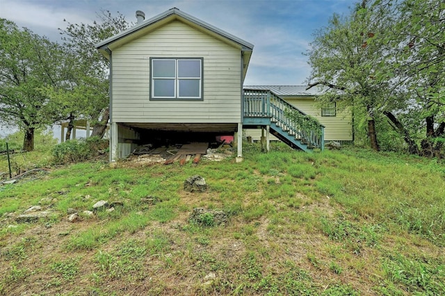 back of property with a wooden deck