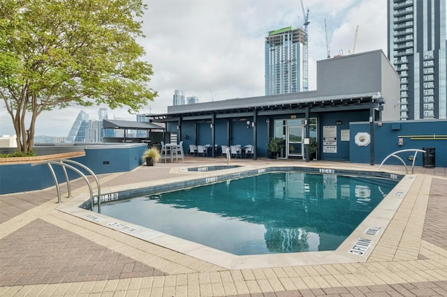 view of pool featuring a patio area