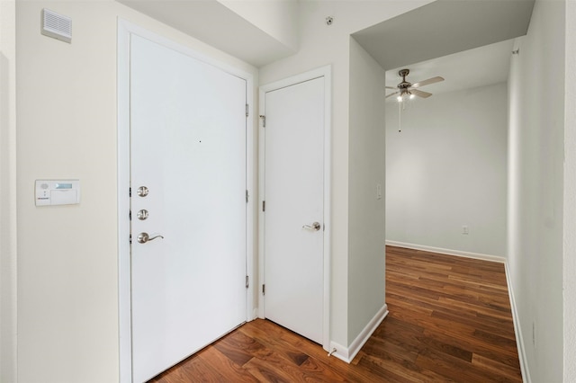 entryway featuring ceiling fan and dark hardwood / wood-style flooring