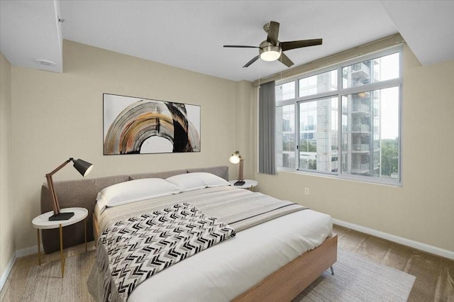 carpeted bedroom featuring ceiling fan