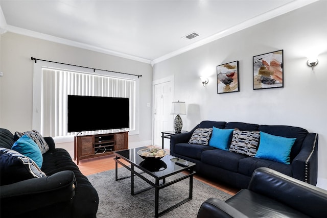 living room with crown molding and wood-type flooring