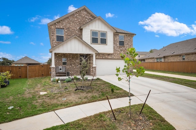 view of front of home featuring a garage and a front yard