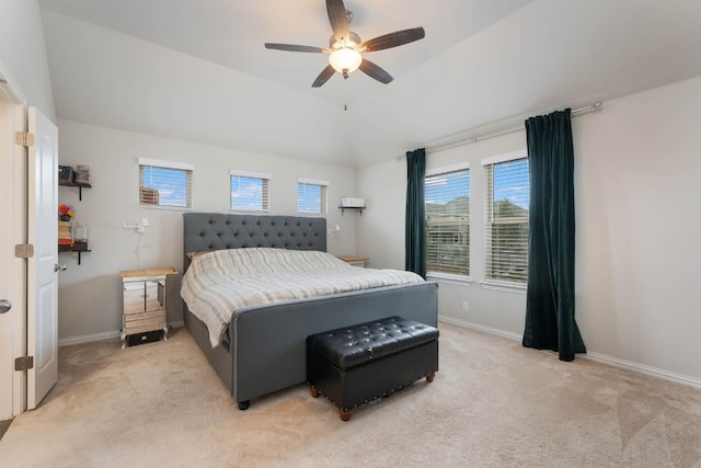 bedroom featuring lofted ceiling, light colored carpet, and ceiling fan