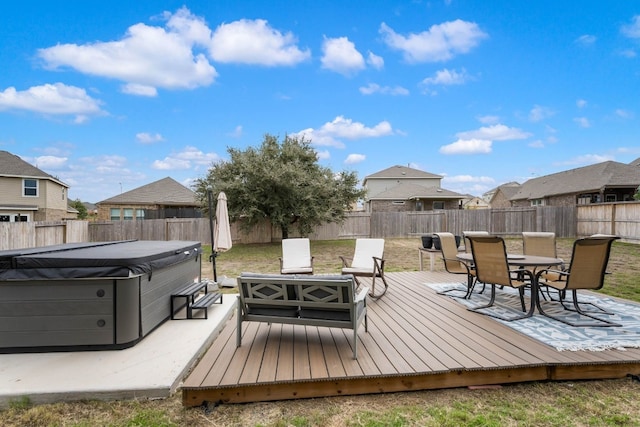 wooden deck featuring a hot tub