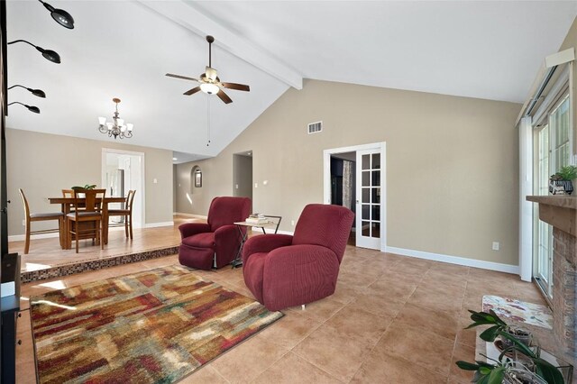 living room with ceiling fan with notable chandelier, high vaulted ceiling, a brick fireplace, beam ceiling, and french doors