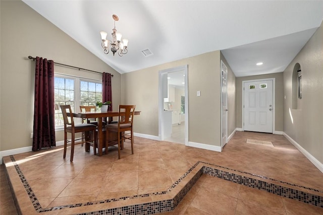 tiled dining room with vaulted ceiling and a chandelier