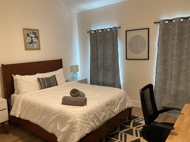 bedroom featuring hardwood / wood-style floors