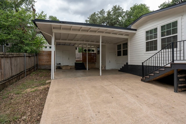 view of parking / parking lot featuring a carport