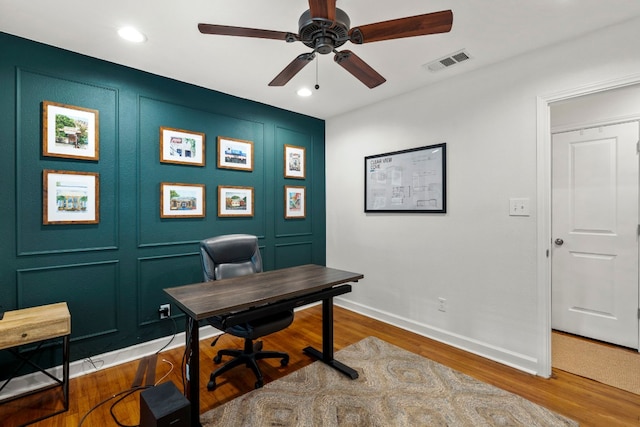 office space with ceiling fan and hardwood / wood-style floors