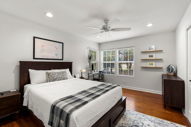 bedroom with ceiling fan and dark hardwood / wood-style flooring