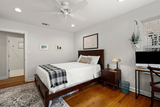 bedroom with hardwood / wood-style floors and ceiling fan