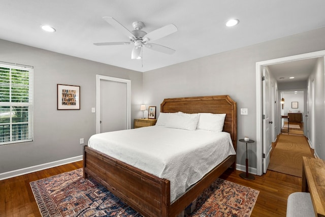 bedroom with ceiling fan and dark wood-type flooring