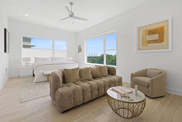 bedroom with ceiling fan and light hardwood / wood-style floors