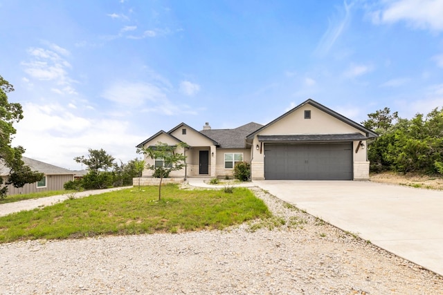 view of front of house with a garage and a front yard