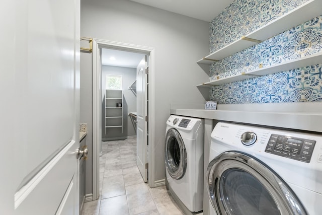 laundry area featuring light tile patterned flooring and independent washer and dryer