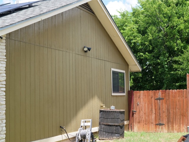 view of side of property featuring central AC unit