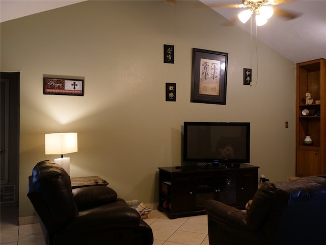 living room featuring light tile patterned flooring, vaulted ceiling, and ceiling fan