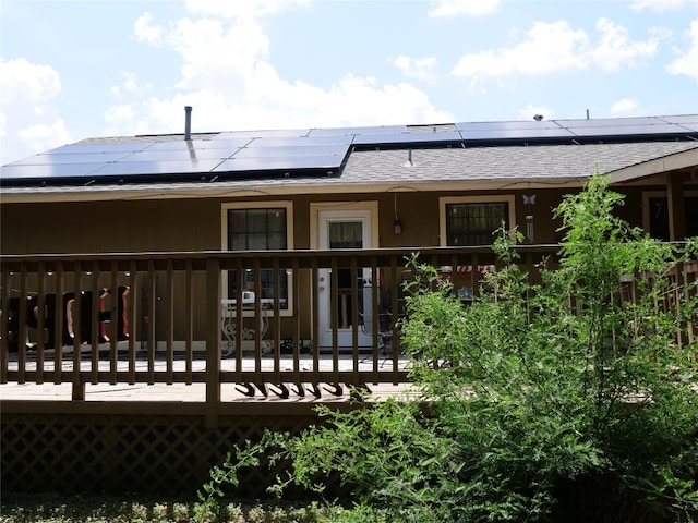 back of house with solar panels