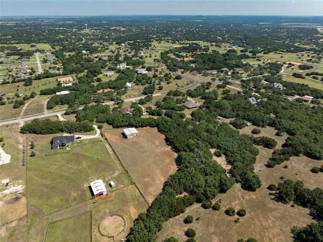 birds eye view of property with a rural view