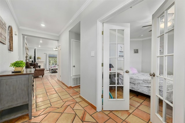 hall featuring recessed lighting, visible vents, baseboards, ornamental molding, and french doors