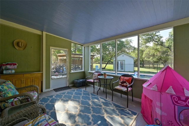 sunroom / solarium featuring a healthy amount of sunlight