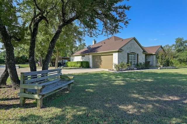 view of home's exterior with a garage, stone siding, a yard, and a chimney