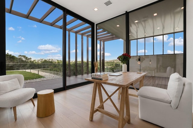 sunroom / solarium featuring a wealth of natural light and visible vents