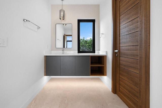 bathroom featuring vanity and baseboards