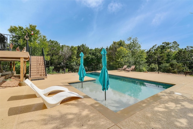 view of pool featuring a patio area