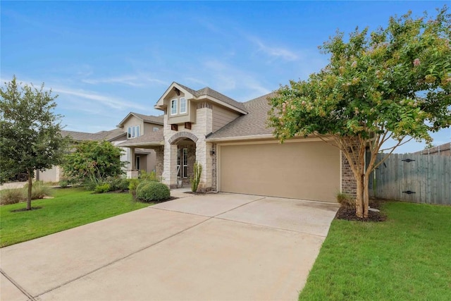 view of front of property with a garage, stone siding, a front yard, and fence