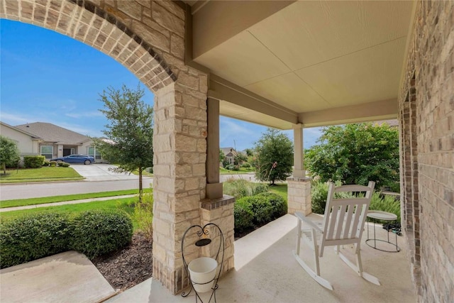 view of patio featuring a porch