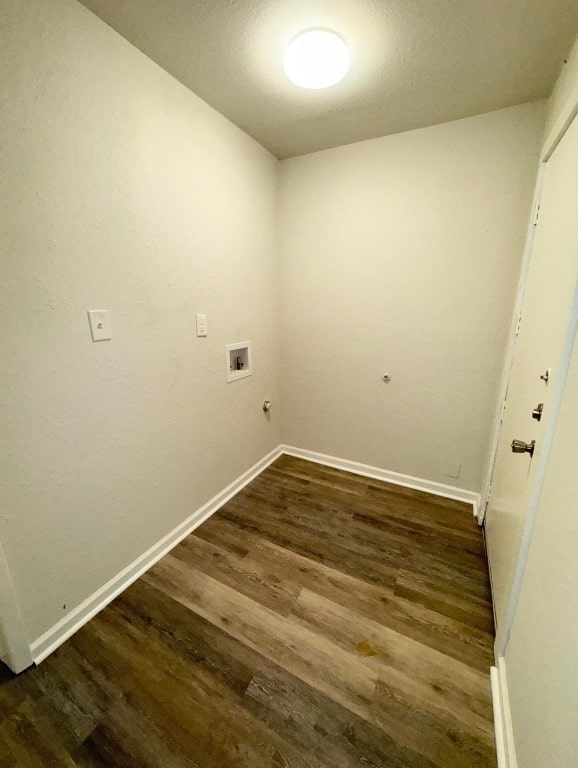 laundry room featuring dark hardwood / wood-style flooring and washer hookup