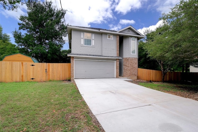 view of front facade featuring a garage and a front yard