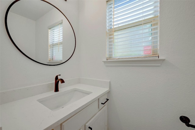 bathroom with a wealth of natural light and vanity