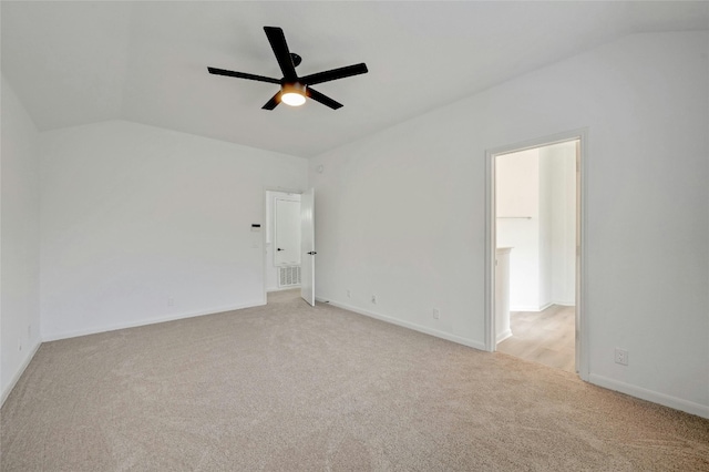 spare room with light colored carpet, ceiling fan, and lofted ceiling